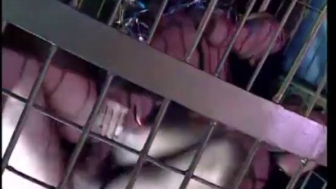 Vintage fetish porn of a woman fucked in a cage