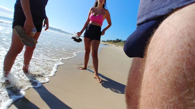 Public erection bulge flash 2 young MILF on beach